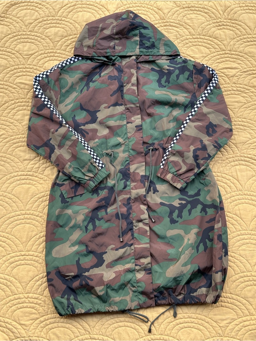 Eggie camo raincoat with checkered sleeves